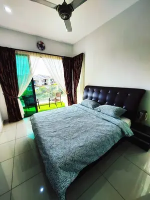a bedroom with a large bed with a blue blanket at ●STG12●3-Storey●Private House●2step Access Garden● in Bayan Lepas