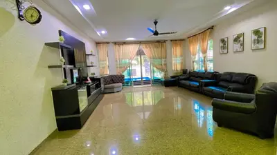 a living room with a couch and a tv at Homestay Seri Pangkor in Pangkor