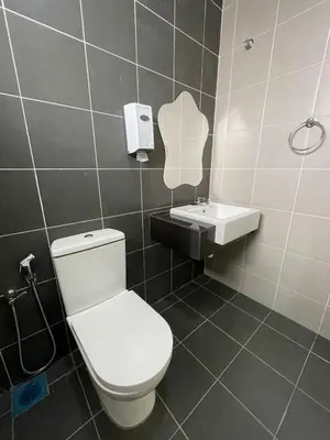 a bathroom with a toilet and a sink at Golden Hill Home by Dreamscape in Cameron Highlands