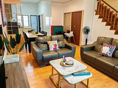 a living room with two couches and a table at W25 atGoldenHills NightMarket WiFi 4R in Brinchang