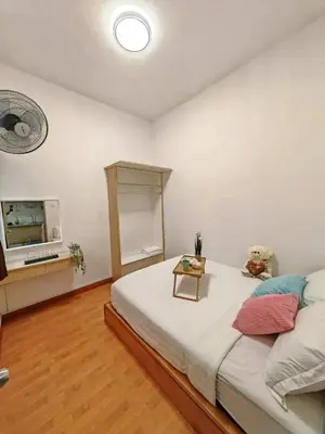 a bedroom with a large bed and a tv at W25 atGoldenHills NightMarket WiFi 4R in Brinchang