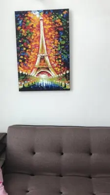a painting of the eiffel tower on a wall at W3WarmStay@GoldenHills/3RPenthouse/WiFi/PasarMalam/2carpark in Brinchang