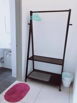 a bathroom with a towel rack next to a sink at W3WarmStay@GoldenHills/3RPenthouse/WiFi/PasarMalam/2carpark in Brinchang