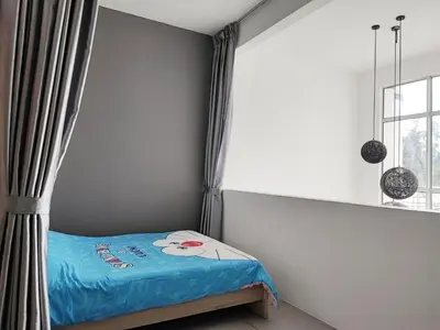 a bedroom with a bed with a mickey mouse pillow on it at W6WarmStay@GoldenHills/3RPenthouse/WiFi/PasarMalamView/2carpark in Brinchang