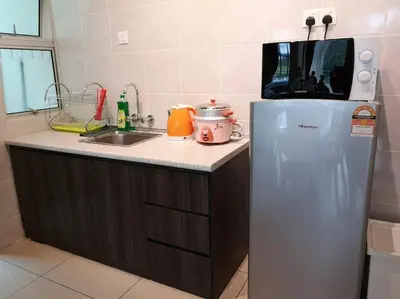 a kitchen with a sink and a refrigerator at W6WarmStay@GoldenHills/3RPenthouse/WiFi/PasarMalamView/2carpark in Brinchang