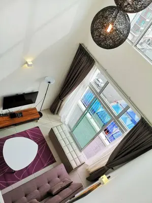 an overhead view of a living room with a couch and window at W6WarmStay@GoldenHills/3RPenthouse/WiFi/PasarMalamView/2carpark in Brinchang