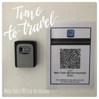 a clock on a wall with the words time to transfer at Meru Oasis at Casa Kayangan Ipoh in Ipoh