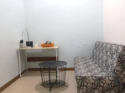 a room with a chair and a table and a desk at W13 atGoldenHills NightMarket WiFi 4R in Brinchang