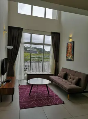 a living room with a couch and a table at W5WarmStay@Golden Hill/Penthouse/WiFi/3R/NightMarket/2CarPark in Brinchang