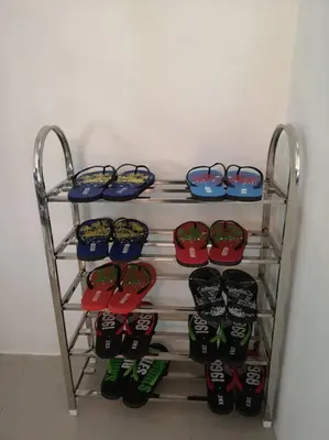 a rack with a bunch of shoes and glasses at W36 WarmStay atGoldenHills NightMarket 4R Wifi BBQ in Brinchang