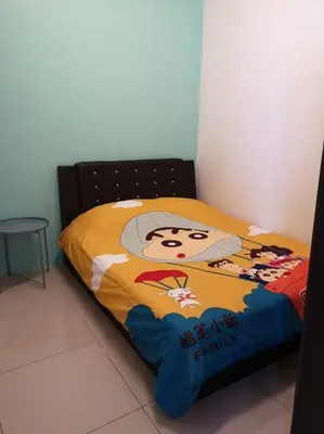 a bed with a picture of a woman on it at W36 WarmStay atGoldenHills NightMarket 4R Wifi BBQ in Brinchang