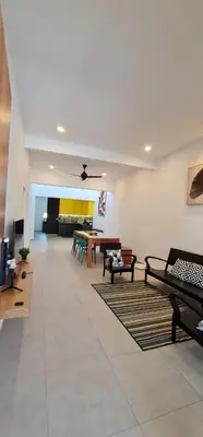 a large living room with couches and a table at Guesthouse @ Ipoh garden II in Ipoh