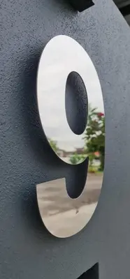 a sculpture of a letter j on a wall at Guesthouse @ Ipoh garden II in Ipoh