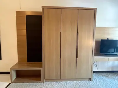 a large wooden cabinet in a room with a tv at Paradise by the Sea in Penang by Veron at Rainbow Paradise in Tanjung Bungah
