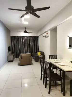 a living room with a ceiling fan and a table and chairs at THE MAJESTIC IPOH B8 by ZamanJa in Ipoh