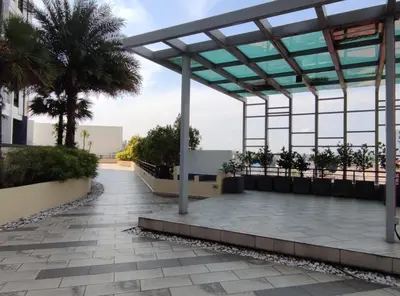 a view of the courtyard of a building with palm trees at THE MAJESTIC IPOH B8 by ZamanJa in Ipoh