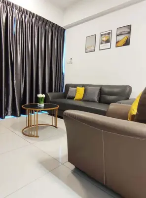 a living room with a couch and a table at THE MAJESTIC IPOH B8 by ZamanJa in Ipoh