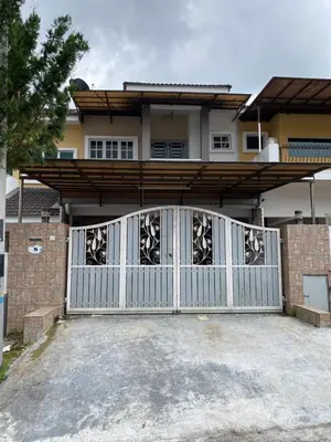 a white gate in front of a house at Azzalea Homes 5 @ Golden Hills Cameron Highlands in Brinchang
