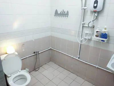 a bathroom with a toilet and a shower at Semi-Detached, Up to 21 Pax, 4 Bedrooms, 3 Bathrooms, 4 Car Parks by Star Home in Bayan Lepas