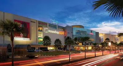 a city street with cars in front of a building at Semi-Detached, Up to 21 Pax, 4 Bedrooms, 3 Bathrooms, 4 Car Parks by Star Home in Bayan Lepas