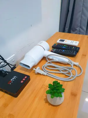 a desk with a computer and a phone and a keyboard at ●SSV10●4pax●Comfort House●13minit●Airpot●CondoPool in Bayan Lepas