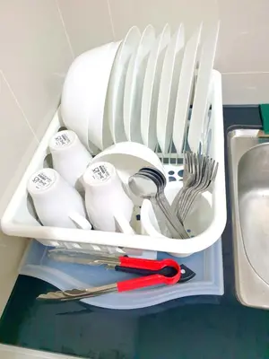 a drawer filled with dishes and utensils next to a sink at ●SSV10●4pax●Comfort House●13minit●Airpot●CondoPool in Bayan Lepas