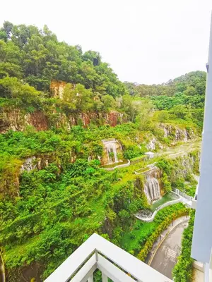 a view of a mountain with waterfalls at ●SSV10●4pax●Comfort House●13minit●Airpot●CondoPool in Bayan Lepas