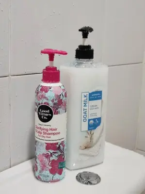 two bottles of soap sitting on top of a sink at W39C WarmStay atGoldenHill NightMarket 2R WiFi CarPark in Brinchang