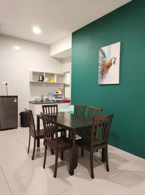 a dining room table and chairs in a kitchen at W39C WarmStay atGoldenHill NightMarket 2R WiFi CarPark in Brinchang