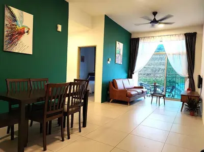 a living room with a table and chairs and a couch at W39C WarmStay atGoldenHill NightMarket 2R WiFi CarPark in Brinchang