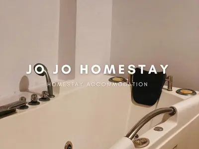 a bathroom with a sign that says jaho honeystay at Jo Jo Homestay @ Marina Island Laguna in Lumut