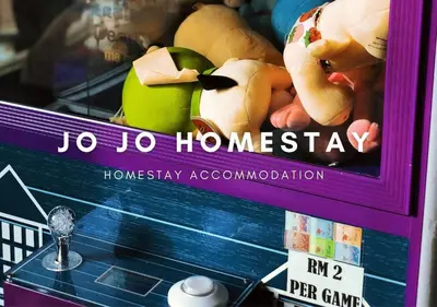 a box with a display of toys on a shelf at Jo Jo Homestay @ Marina Island Laguna in Lumut