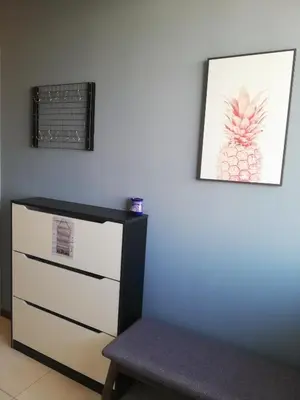 a room with a dresser and a chair next to a wall at The Landmark by Katana 3BR to 4BR Luxury Seaview Landmark Homestay at Gurney 15-16pax \u65e0\u654c\u6d77\u666f\u5957\u623f in Tanjong Tokong