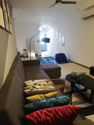 a living room with a couch with pillows on the floor at The Landmark by Katana 3BR to 4BR Luxury Seaview Landmark Homestay at Gurney 15-16pax \u65e0\u654c\u6d77\u666f\u5957\u623f in Tanjong Tokong