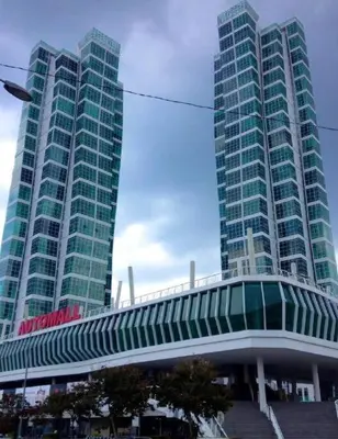 two tall buildings with a bridge in front of them at MARITIME SUITE DUPLEX PENANG- PEMANDANGAN LAUT in George Town