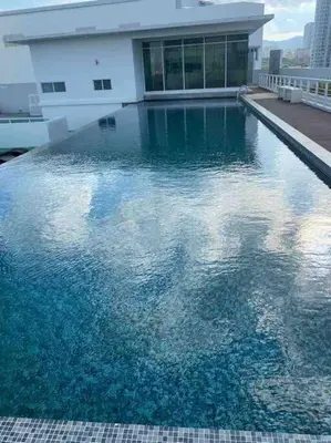 a large pool of water in front of a building at MARITIME SUITE DUPLEX PENANG- PEMANDANGAN LAUT in George Town