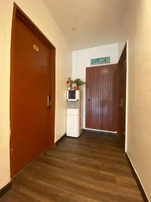 an office hallway with a door and a refrigerator at HOTEL MIRAMA \u7f8e\u9e97\u83ef\u9152\u5e97 in Sitiawan
