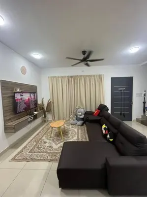 a living room with a black couch and a tv at Hadeerna Homestay - Double storey terrace in Chemor