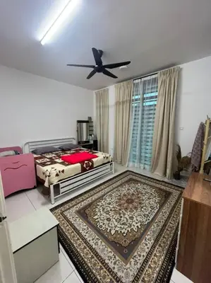 a bedroom with a bed and a ceiling fan at Hadeerna Homestay - Double storey terrace in Chemor