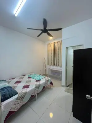 a bedroom with a bed and a ceiling fan at Hadeerna Homestay - Double storey terrace in Chemor