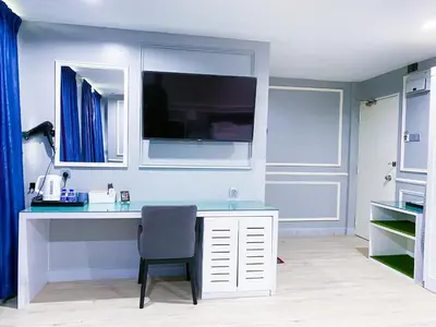 a white desk with a chair in a room at 61 Hotel in Gua Musang