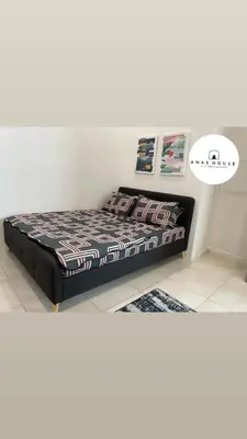 a bedroom with a bed in a room at Anas House in Tanjung Rambutan