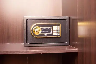a safe with a phone in it on a shelf at King's Lane Ipoh in Ipoh