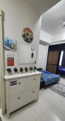 a room with a dresser with potted plants on it at Hannah suite at cameronfair in Cameron Highlands