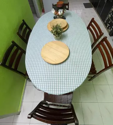 a table with two wooden plates on top of it at HomestayMuslim Di Teluk Intan in Teluk Intan