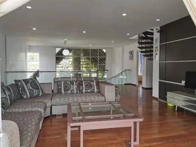 a living room with a couch and a coffee table at Dear Dino Villa Cameron Highlands in Cameron Highlands