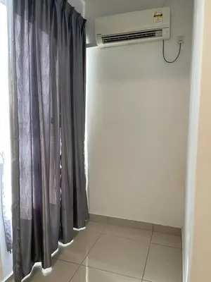 a room with a black curtain and a heater at Marina Heights Hotel Residency in Lumut