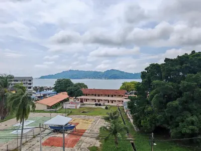 a view of a building and a body of water at Pangkor Pop Ash Hotel in Pangkor