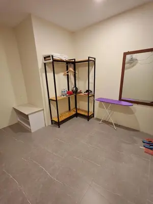 a room with a shelf and a mirror and a table at Pangkor Pop Ash Hotel in Pangkor