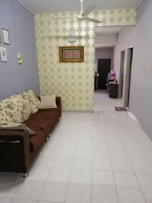 a living room with a couch in a room at HOMESTAY PERPADUAN, TAMAN BERCHAM RAYA ULU KINTA IPOH PERAK in Kampong Batu Lapan